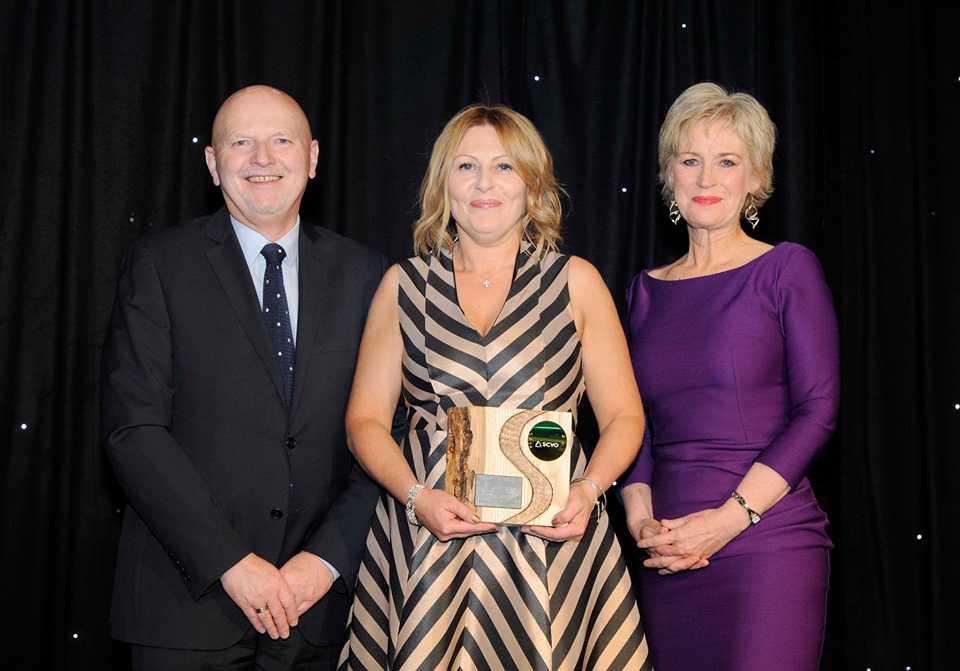 Louise Russell being presented with award by Alan Sherry and Sally Magnusson