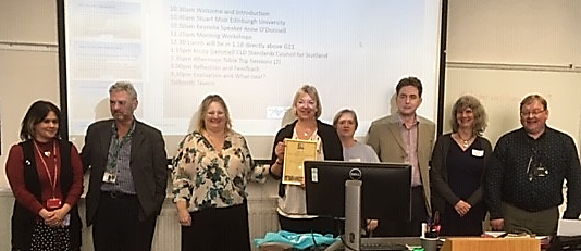Committee of South East & Central CLD Professional Learning Consortium and Diann Govenlock, Chair, accepting Standards Mark Award