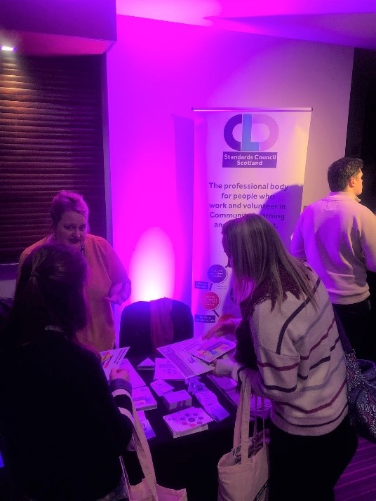 Kirsty Gemmell at the CLD Standards Council stall talking to delegates at the YouthLink Conference